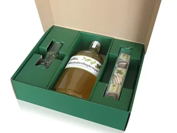 Gift box for a bottle with glass and chocolates Gift box for a bottle with glass and chocolates